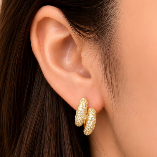 Woman wearing anti tarnish gold toned push back earrings with sparkling textured finish by MahanandaFJ Atelier.