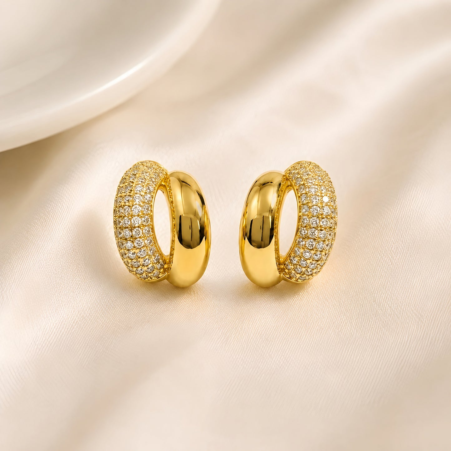 Woman wearing anti tarnish gold toned dual tone push back earrings with polished and sparkling finish by MahanandaFJ Atelier.