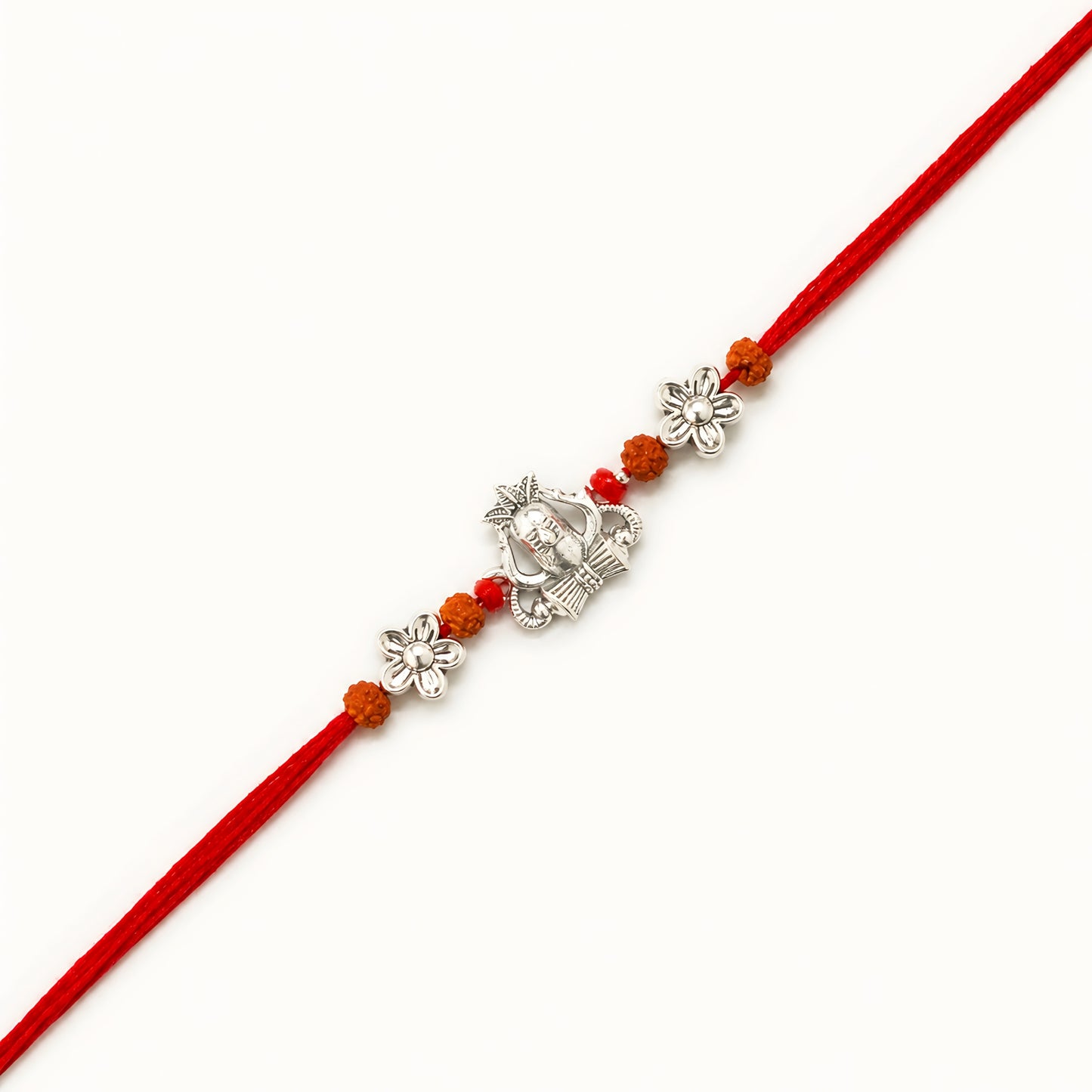 Handcrafted sterling silver Shiva rakhi with Mahadev-inspired centerpiece, rudraksha beads, floral silver accents and premium red thread