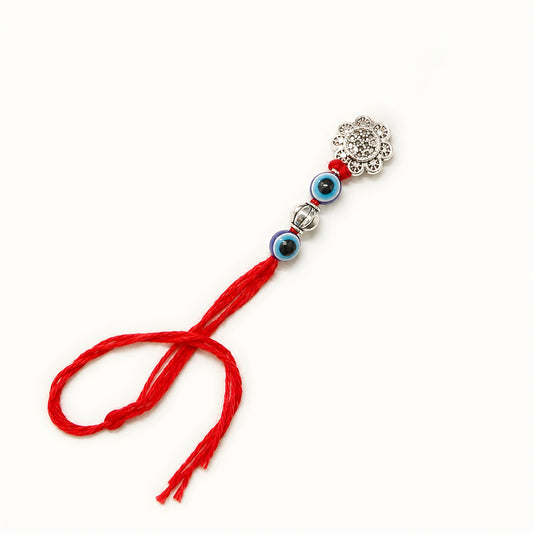 Handcrafted sterling silver floral Bhabhi Rakhi with evil eye beads, decorative silver bead and premium red thread