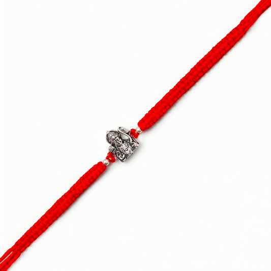 Silver Shri Ram Dhanush Rakhi with Lord Ram bow design and red braided thread for brother on Raksha Bandhan
