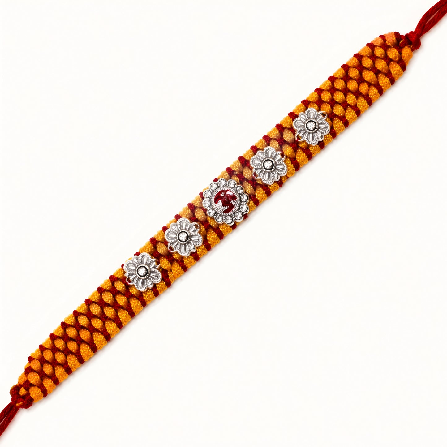 Sterling Silver Om Floral Mauli Rakhi with red enamel Om centrepiece, silver flower motifs and saffron red woven thread
