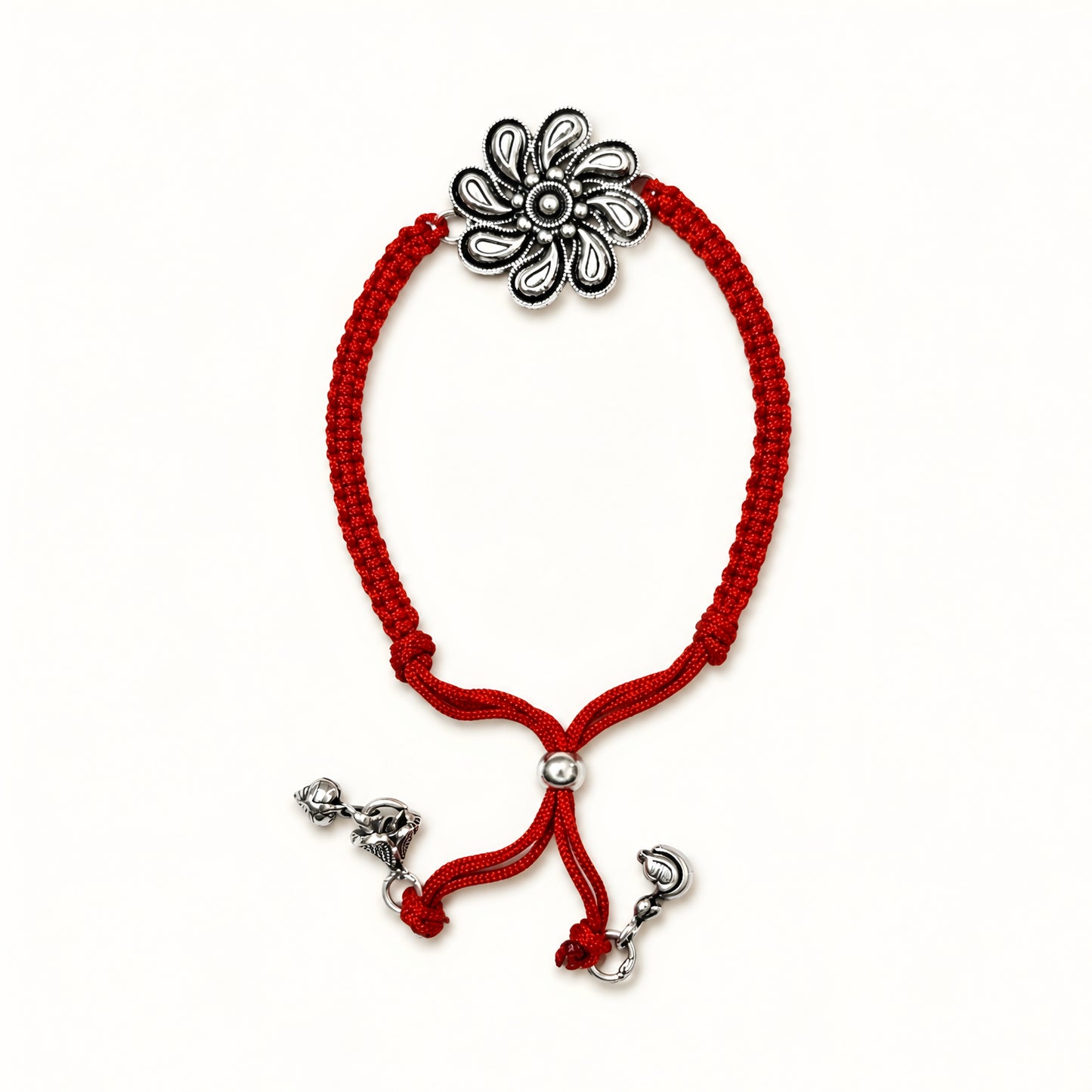 Sterling Silver Floral Lumba Rakhi for Bhabhi with oxidised flower centrepiece, red woven thread and hanging silver charms