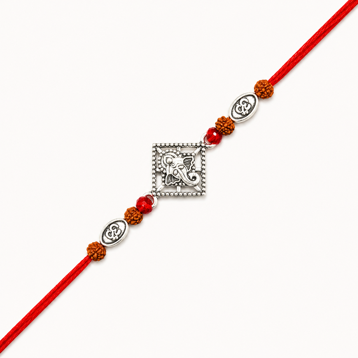 Silver Ganesh Om Rudraksha Rakhi with original Rudraksha beads, Om charms, and handcrafted red thread for Raksha Bandhan