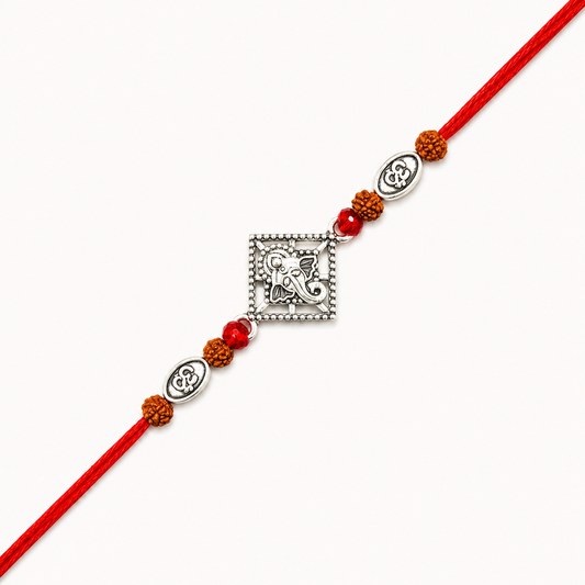 Silver Ganesh Om Rudraksha Rakhi with original Rudraksha beads, Om charms, and handcrafted red thread for Raksha Bandhan