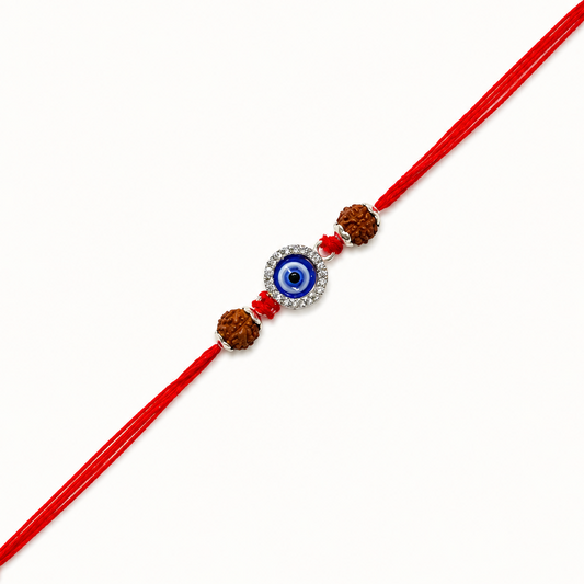Silver Evil Eye Rakhi with blue Nazar charm, original Rudraksha beads and handcrafted red thread for Raksha Bandhan