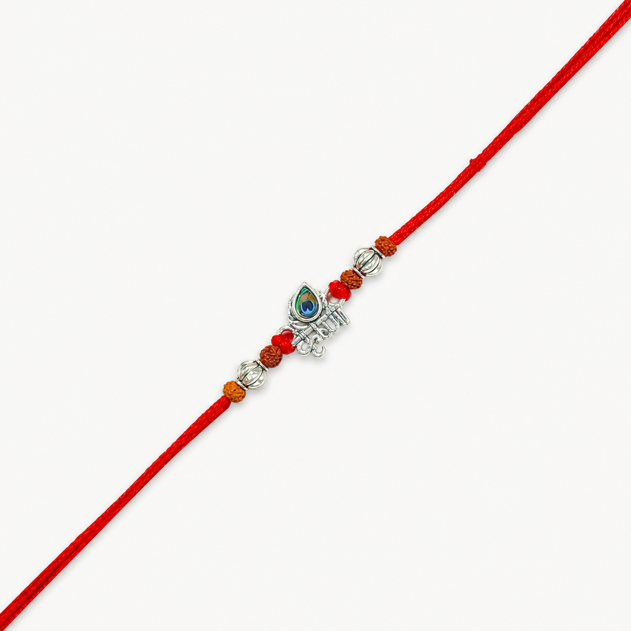 Silver Krishna flute rakhi with peacock feather, original Rudraksha beads and red thread for Raksha Bandhan