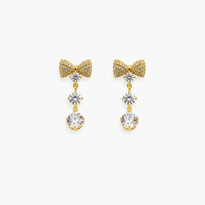 18 KT gold plated crystal bow drop earrings for women with anti tarnish finish featuring sparkling cubic zirconia stones