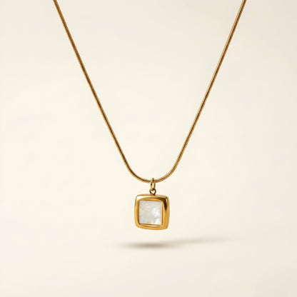 Minimal gold-tone square pendant necklace with a luminous white inlay on a delicate chain, elegant daily wear jewellery for women.
