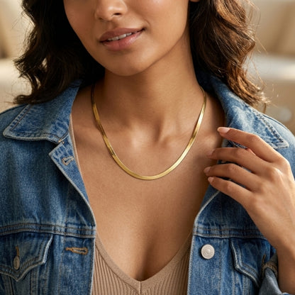 Minimalist gold herringbone chain necklace featuring a flat snake design with a polished finish for everyday wear and layering.