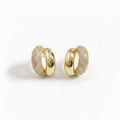 Woman wearing anti tarnish gold toned dual tone push back earrings with polished and sparkling finish by MahanandaFJ Atelier.