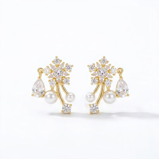 Woman wearing anti tarnish gold toned floral pearl push back earrings with sparkling stone detailing by MahanandaFJ Atelier.