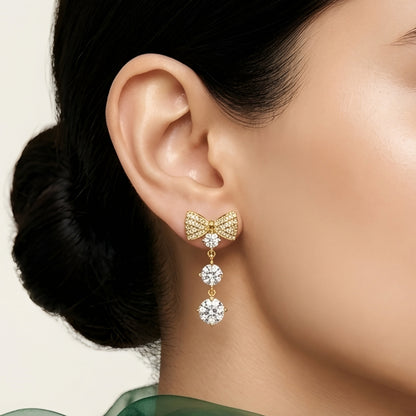 18 KT gold plated crystal bow drop earrings for women with anti tarnish finish featuring sparkling cubic zirconia stones