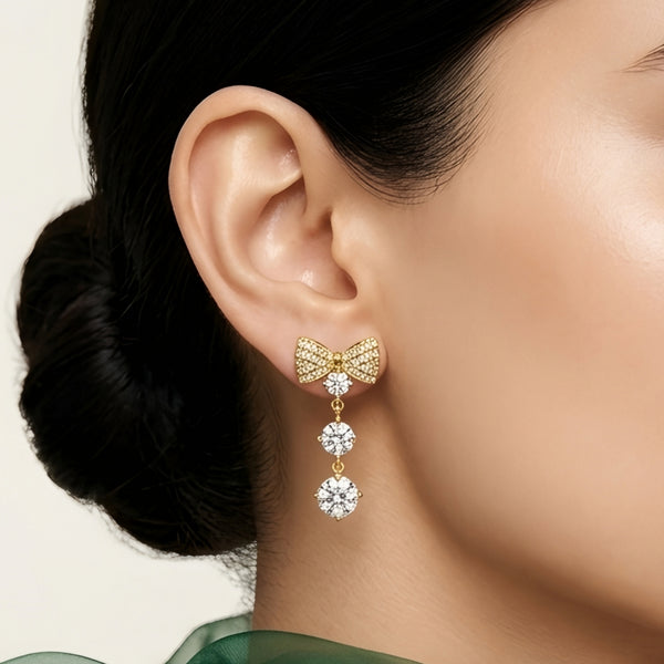 18 KT gold plated crystal bow drop earrings for women with anti tarnish finish featuring sparkling cubic zirconia stones