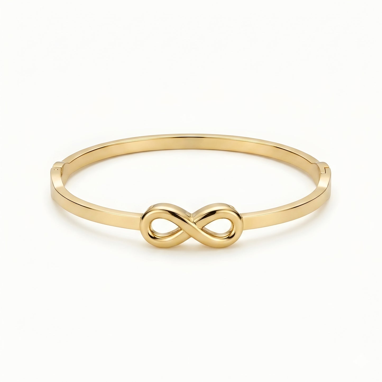 Minimalist gold infinity bangle bracelet with polished finish for women, elegant luxury everyday jewelry.