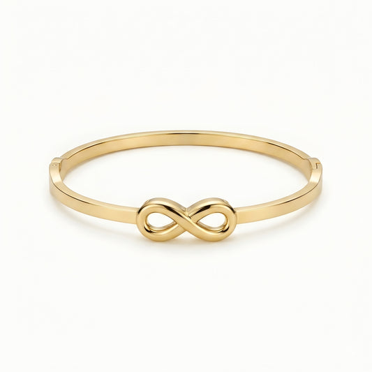 Minimalist gold infinity bangle bracelet with polished finish for women, elegant luxury everyday jewelry.