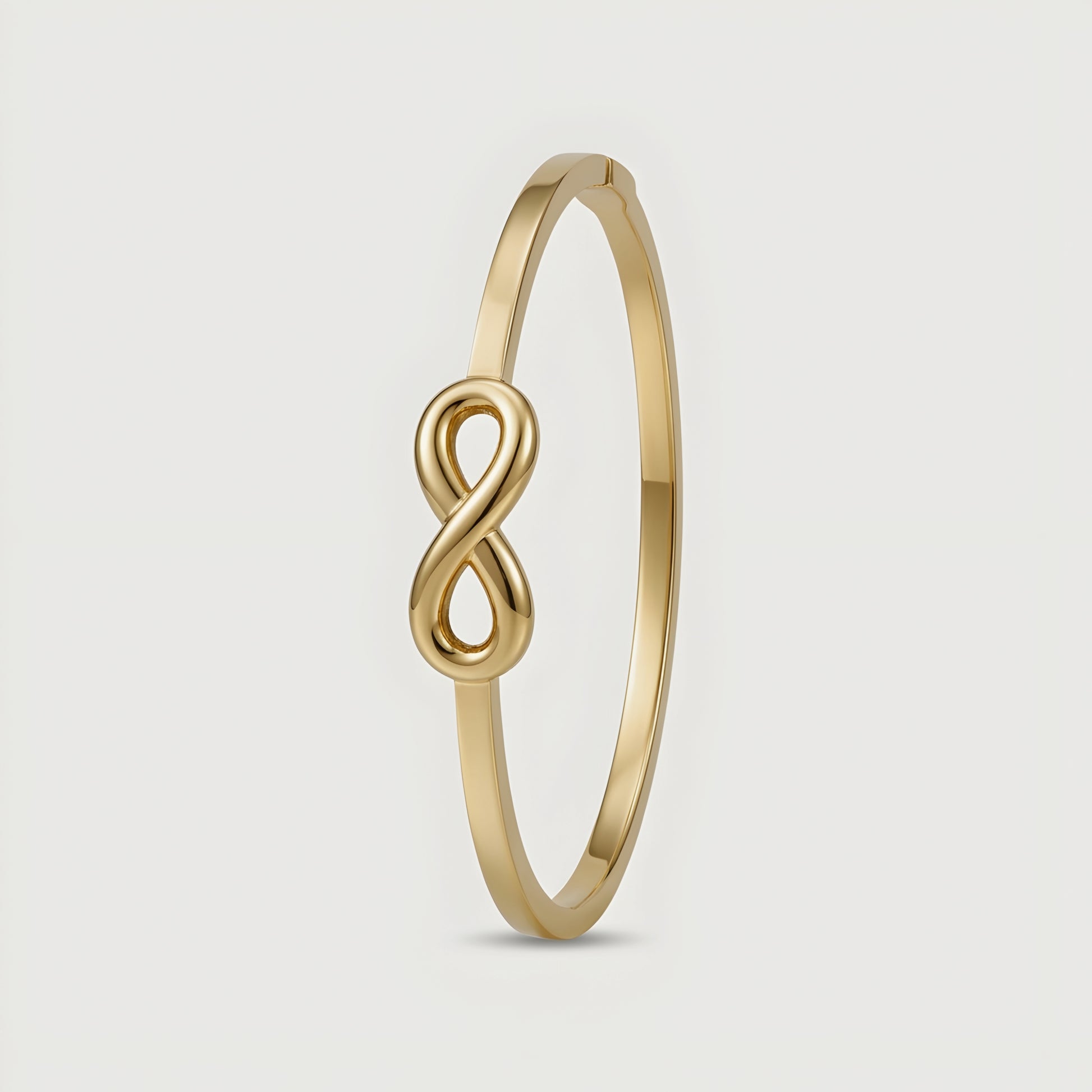 Minimalist gold infinity bangle bracelet with polished finish for women, elegant luxury everyday jewelry.