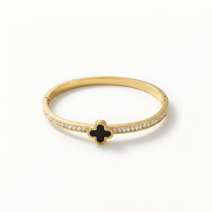 Gold plated black clover crystal bangle bracelet for women with sparkling zircon stones, worn on a model, perfect for daily wear and elegant styling.