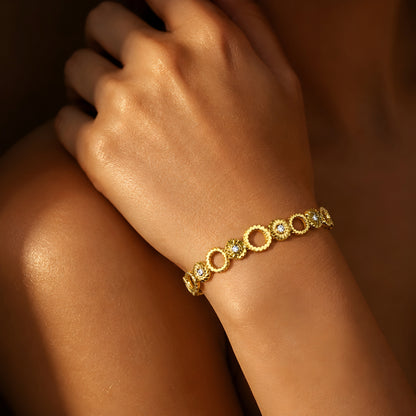 Elegant gold circle crystal bracelet for women featuring modern circular links and sparkling crystal accents.