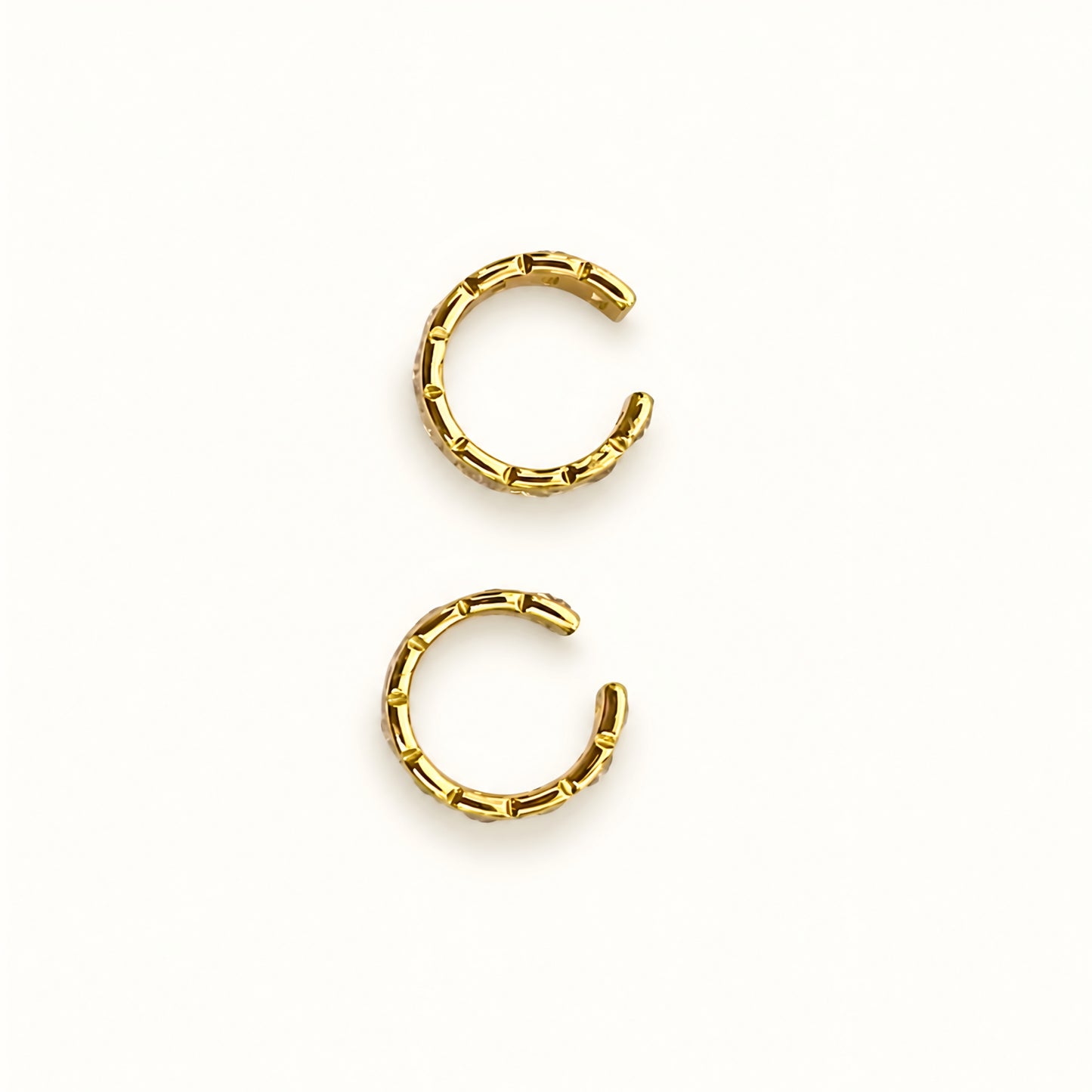 Gold plated ear cuff with square-cut clear crystals for women, anti-tarnish no-piercing ear cuff, lightweight minimalist fashion jewellery for everyday and party wear.
