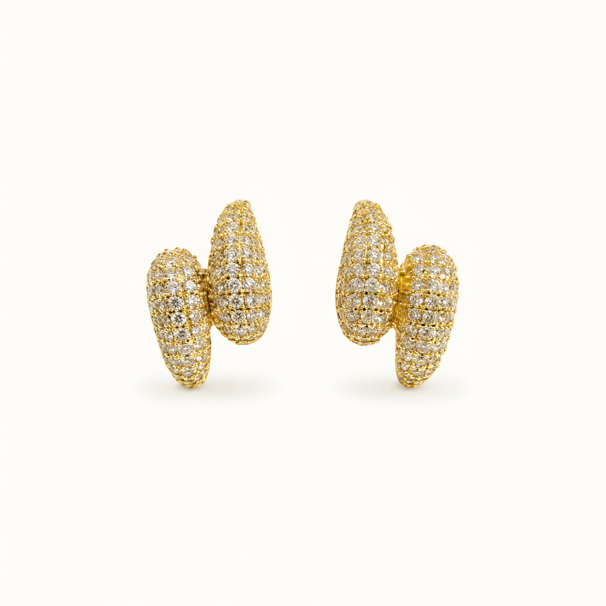 Woman wearing anti tarnish gold toned push back earrings with sparkling textured finish by MahanandaFJ Atelier.