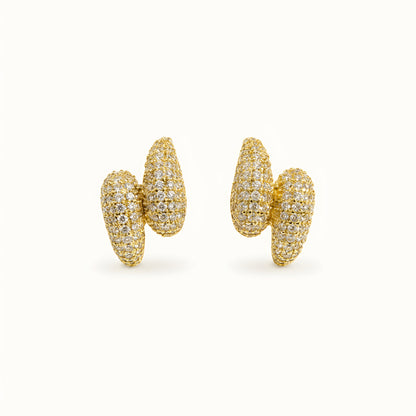 Woman wearing anti tarnish gold toned push back earrings with sparkling textured finish by MahanandaFJ Atelier.