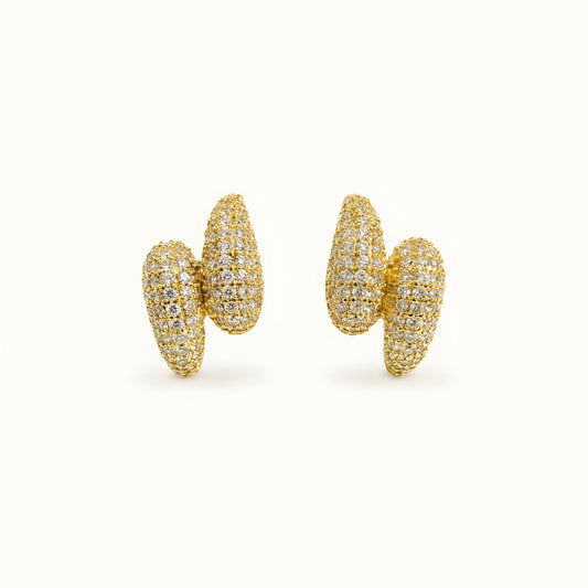 Woman wearing anti tarnish gold toned push back earrings with sparkling textured finish by MahanandaFJ Atelier.