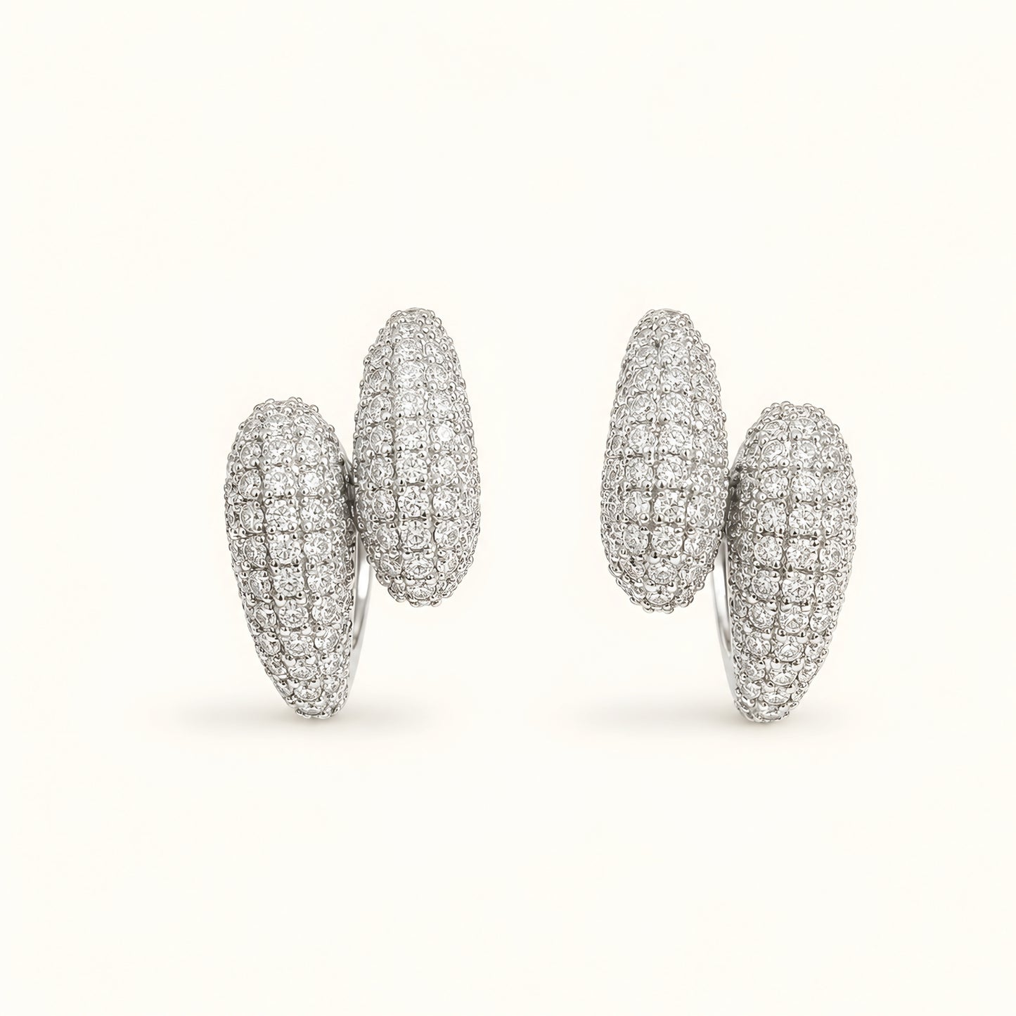Silver toned anti tarnish pave stud earrings with diamond-look stones and push-back closure for women.