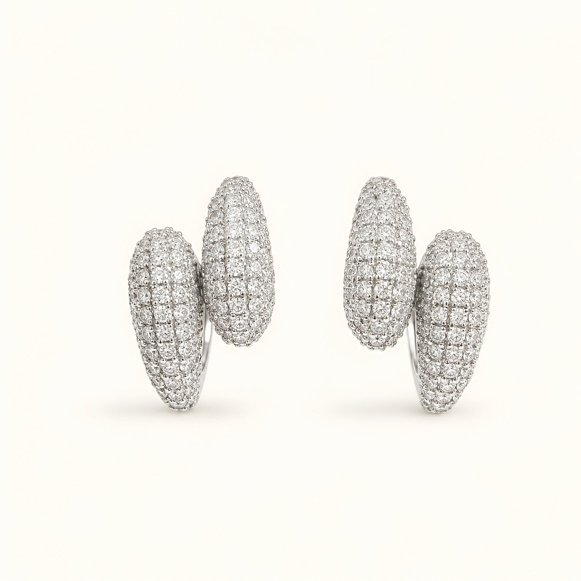 Silver toned anti tarnish pave stud earrings with diamond-look stones and push-back closure for women.