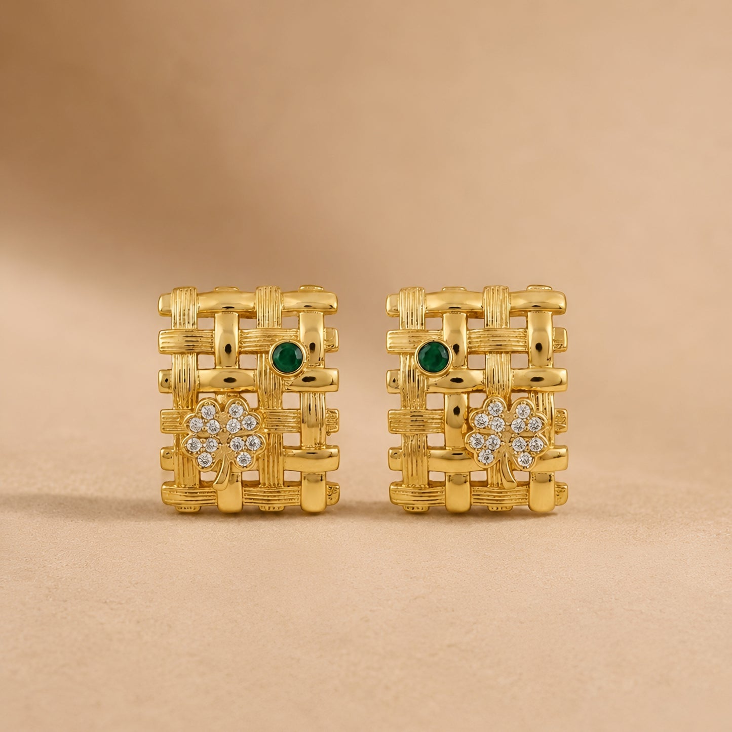 Woman wearing anti tarnish gold toned geometric push back earrings with green stone detail by MahanandaFJ Atelier.