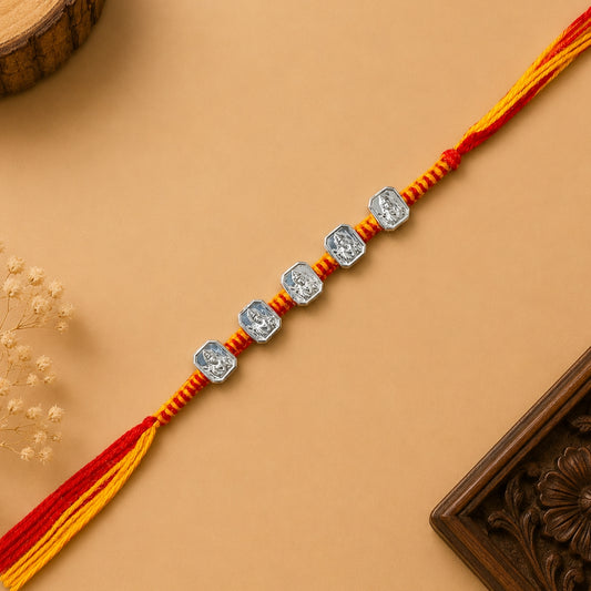 Silver Panch Shree Ram Rakhi featuring five Lord Ram silver charms on a handcrafted red and yellow braided thread for Raksha Bandhan
