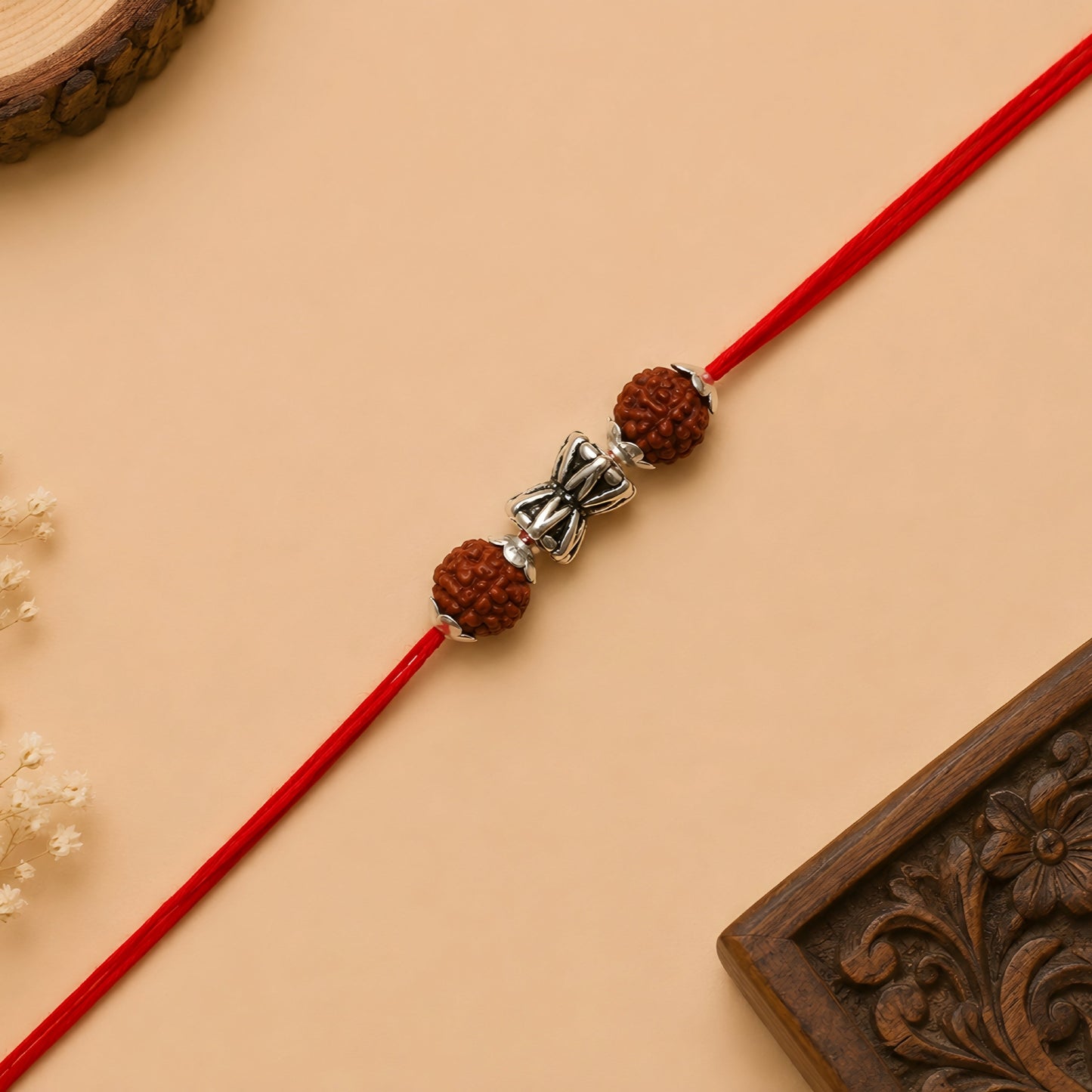 Silver Damru Rakhi with original Rudraksha beads and red thread for Raksha Bandhan