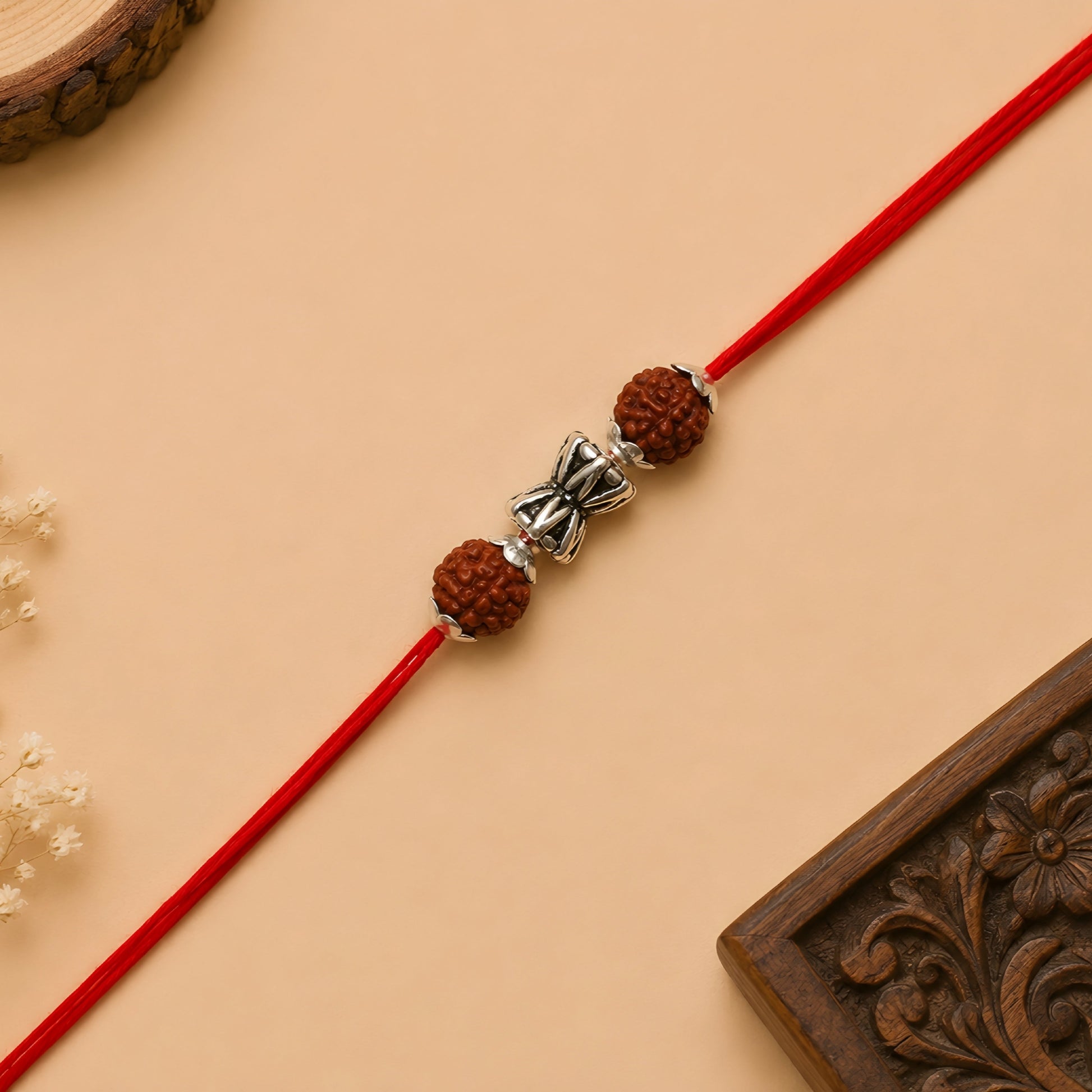 Silver Damru Rakhi with original Rudraksha beads and red thread for Raksha Bandhan
