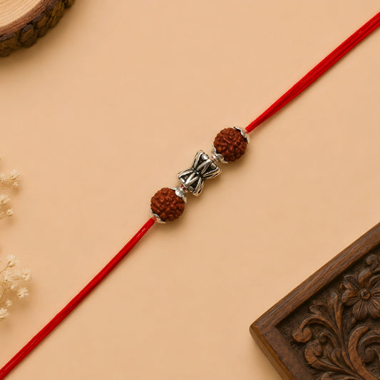 Silver Damru Rakhi with original Rudraksha beads and red thread for Raksha Bandhan