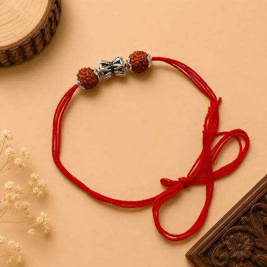 Silver Damru Rakhi with original Rudraksha beads and red thread for Raksha Bandhan