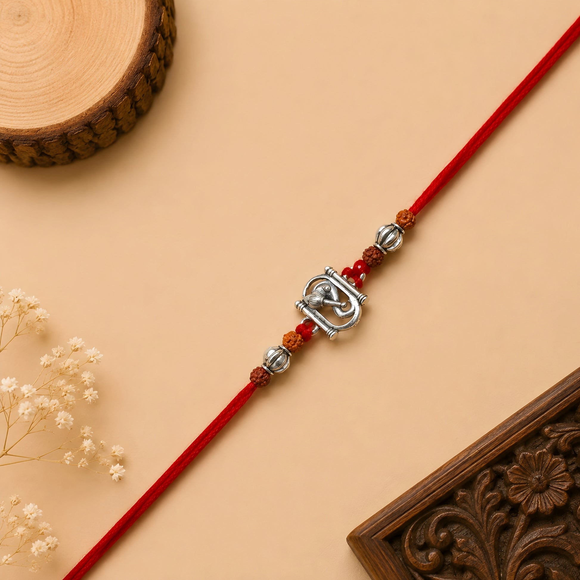 Silver Ganesh Rakhi with original Rudraksha beads and red thread for Raksha Bandhan gift