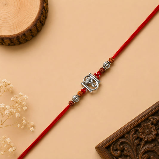 Silver Ganesh Rakhi with original Rudraksha beads and red thread for Raksha Bandhan gift