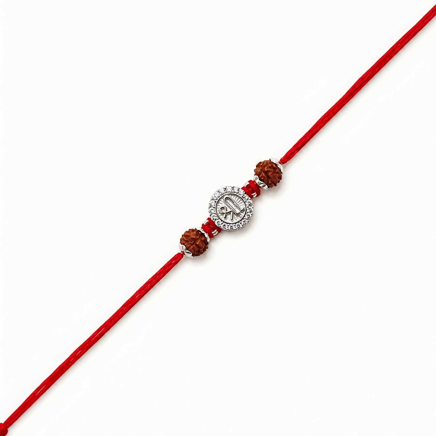 Silver Shree Rudraksha Rakhi featuring the sacred Shree symbol, original Rudraksha beads, and handcrafted red thread for Raksha Bandhan
