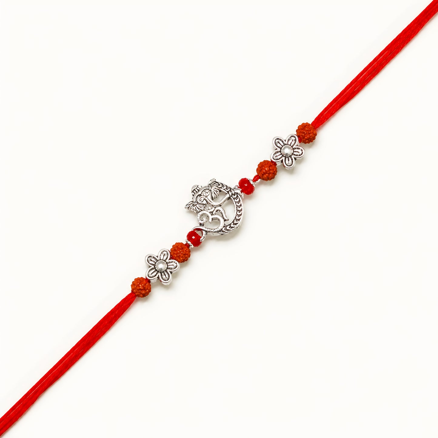 Handcrafted 925 silver Ganesh rakhi with crescent moon design, rudraksha beads, floral silver spacers and red thread for Raksha Bandhan