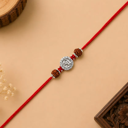 Silver Shree Rudraksha Rakhi featuring the sacred Shree symbol, original Rudraksha beads, and handcrafted red thread for Raksha Bandhan