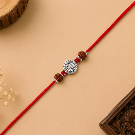 Silver Shree Rudraksha Rakhi featuring the sacred Shree symbol, original Rudraksha beads, and handcrafted red thread for Raksha Bandhan