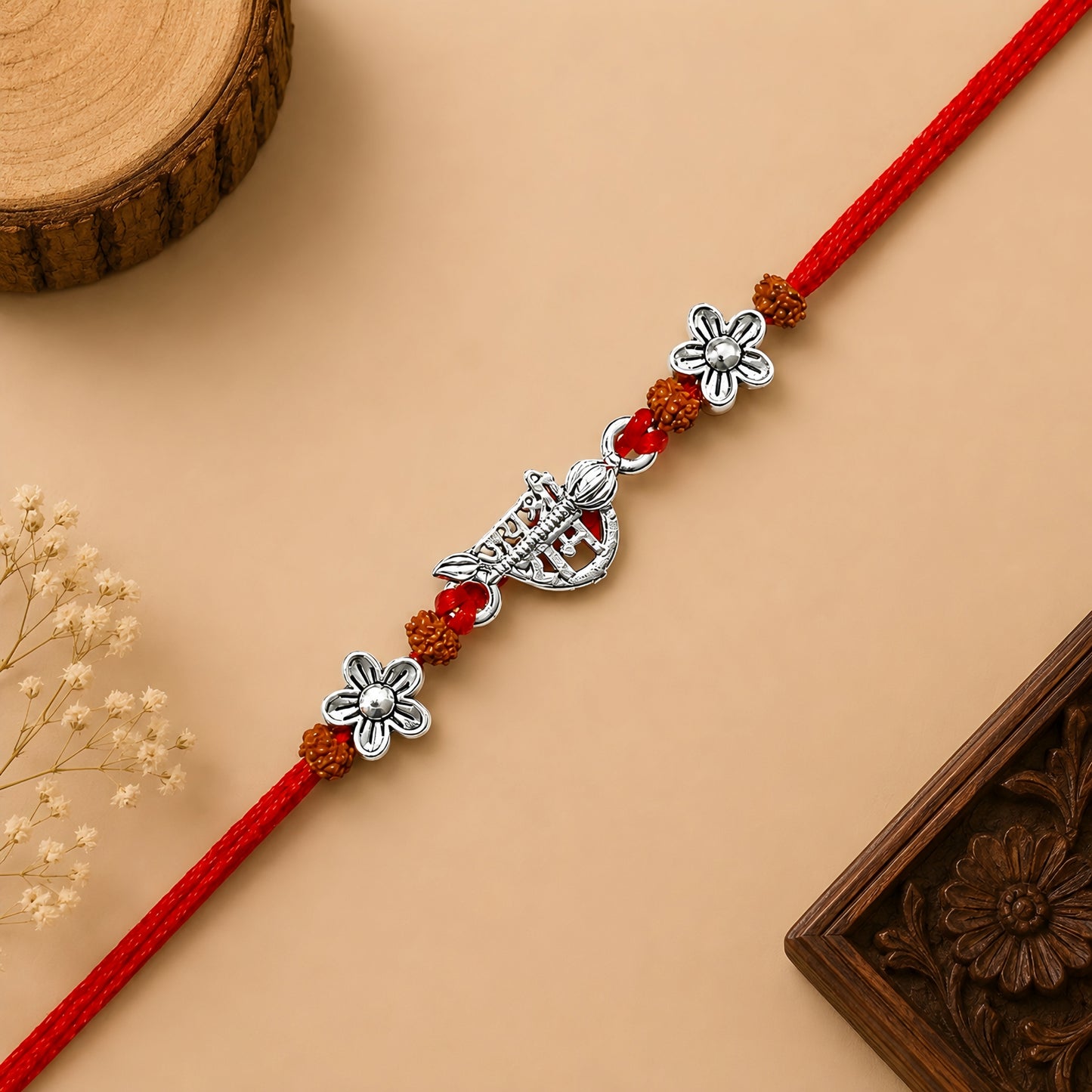 Silver Jai Shree Ram Rudraksha Rakhi with original Rudraksha beads, floral silver accents and handcrafted red thread for Raksha Bandhan
