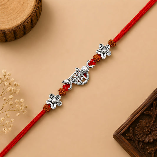Silver Jai Shree Ram Rudraksha Rakhi with original Rudraksha beads, floral silver accents and handcrafted red thread for Raksha Bandhan