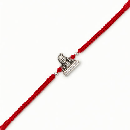 Silver Adiyogi stone Rakhi with Lord Shiva centerpiece and adjustable red thread for brother on Raksha Bandhan