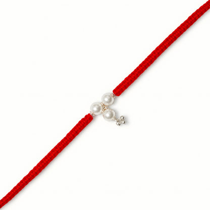 Sterling Silver Triple Pearl Bhabhi Rakhi with three white pearl beads, silver charm and broad red woven thread