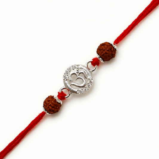Sterling Silver Om Rudraksha Rakhi with circular silver Om centrepiece, two Rudraksha beads and red thread for brother