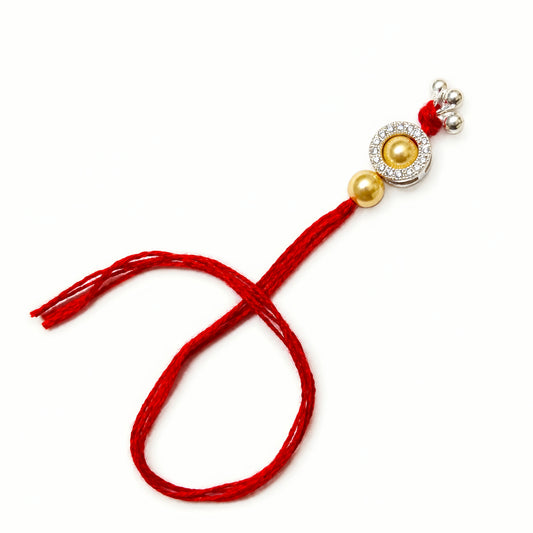 Sterling Silver Golden Halo Lumba Rakhi for Bhabhi with gold-tone beads, clear stone border, silver charms and red thread