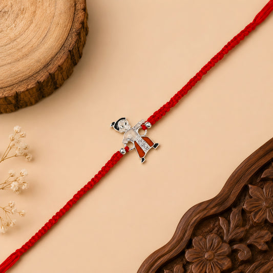 Sterling Silver Little Warrior Kids Rakhi with orange enamel cartoon centrepiece, silver beads and red woven thread
