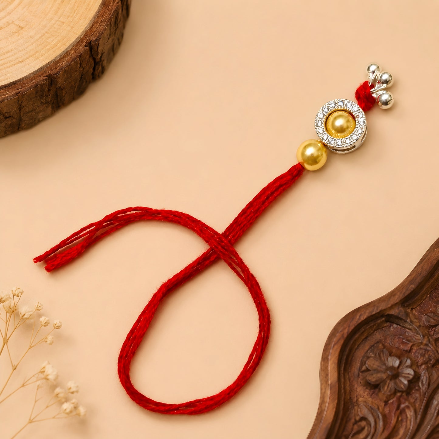 Sterling Silver Golden Halo Lumba Rakhi for Bhabhi with gold-tone beads, clear stone border, silver charms and red thread