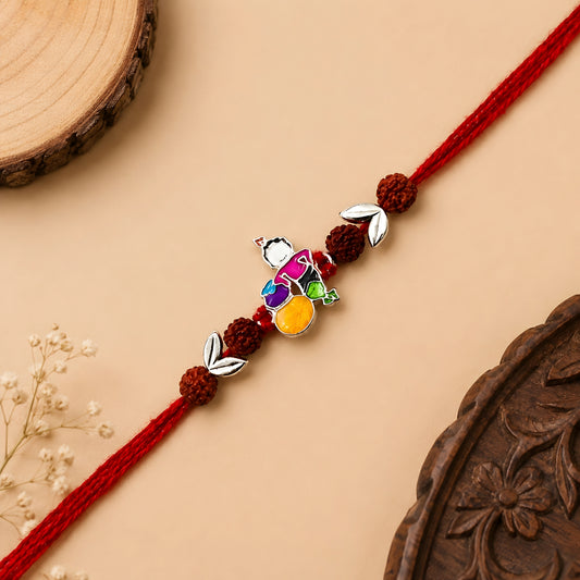 Sterling Silver Bal Krishna Matki Rudraksha Rakhi with colourful enamel motif, silver leaves and red thread for brother